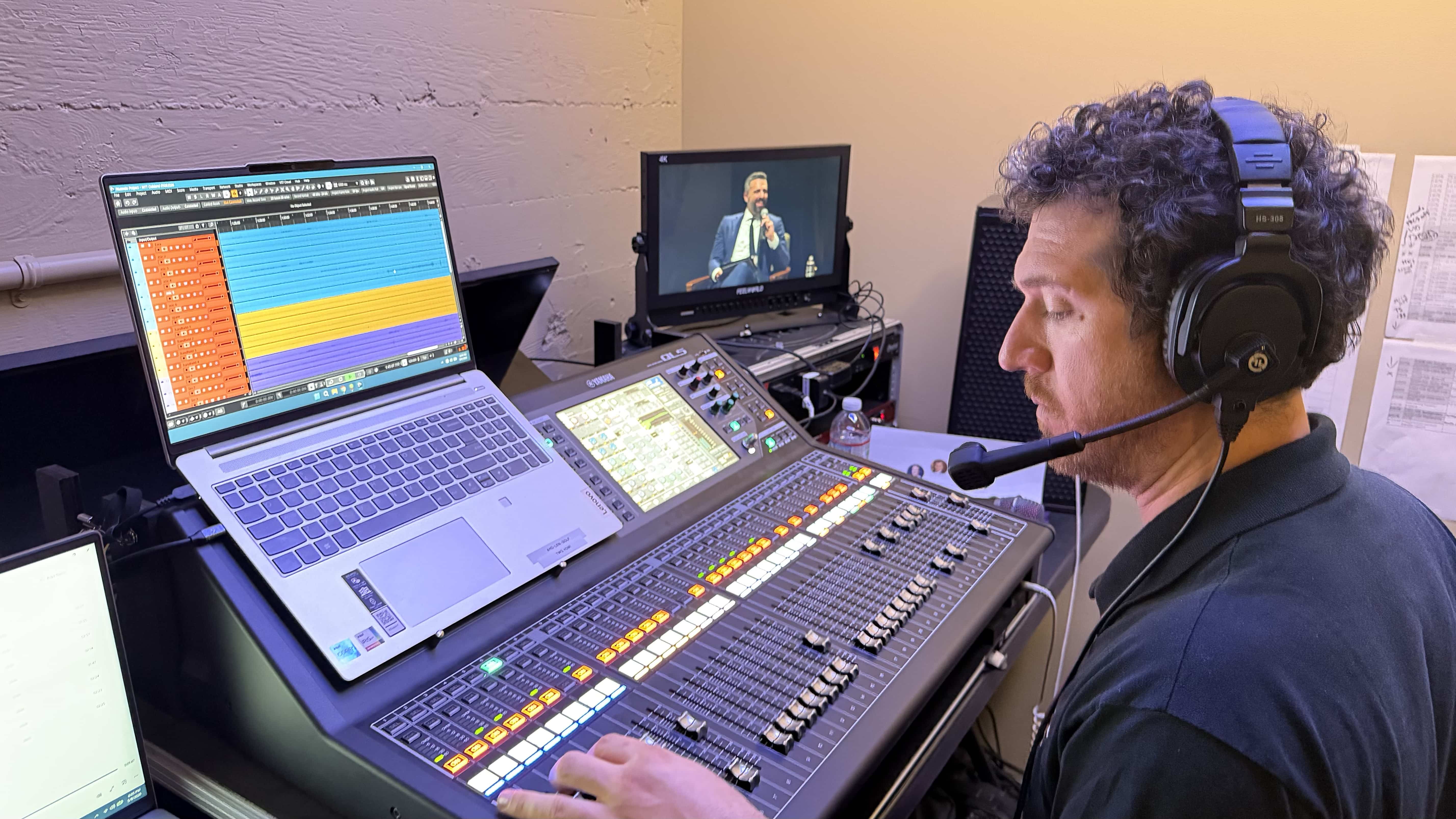 Audio operator mixing the Ezra Klein Show live forum on a Yamaha console